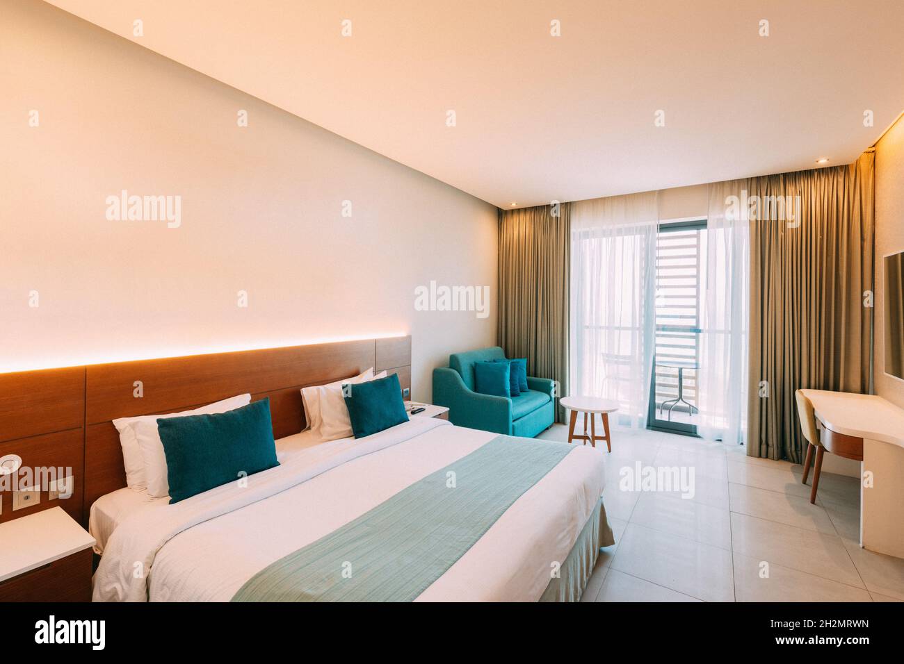 Hotel Room With Bed And Balcony With View On Sea. Home Interior With