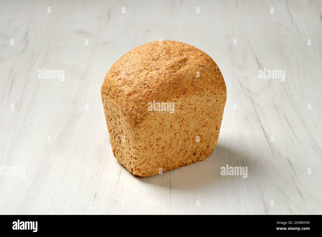 Artisan bread made from oats seeds on kitchen table Stock Photo