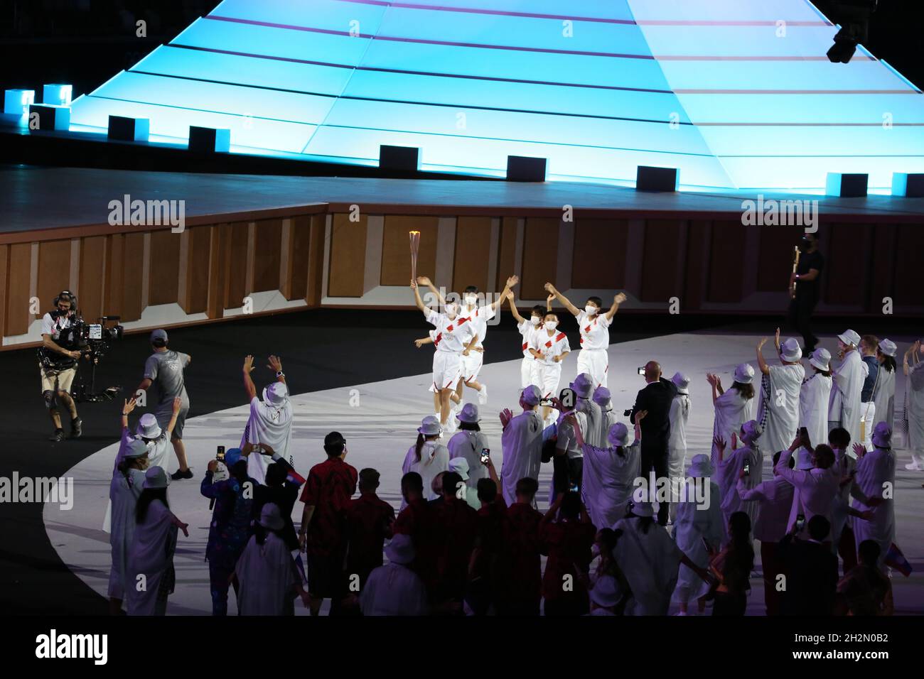 JULY 23rd, 2021 - TOKYO, JAPAN: The olympic flame is carried during the Opening Ceremony of the Tokyo 2020 Olympic Games by AOKI Kokona, NAKAZAWA Ren, Stock Photo