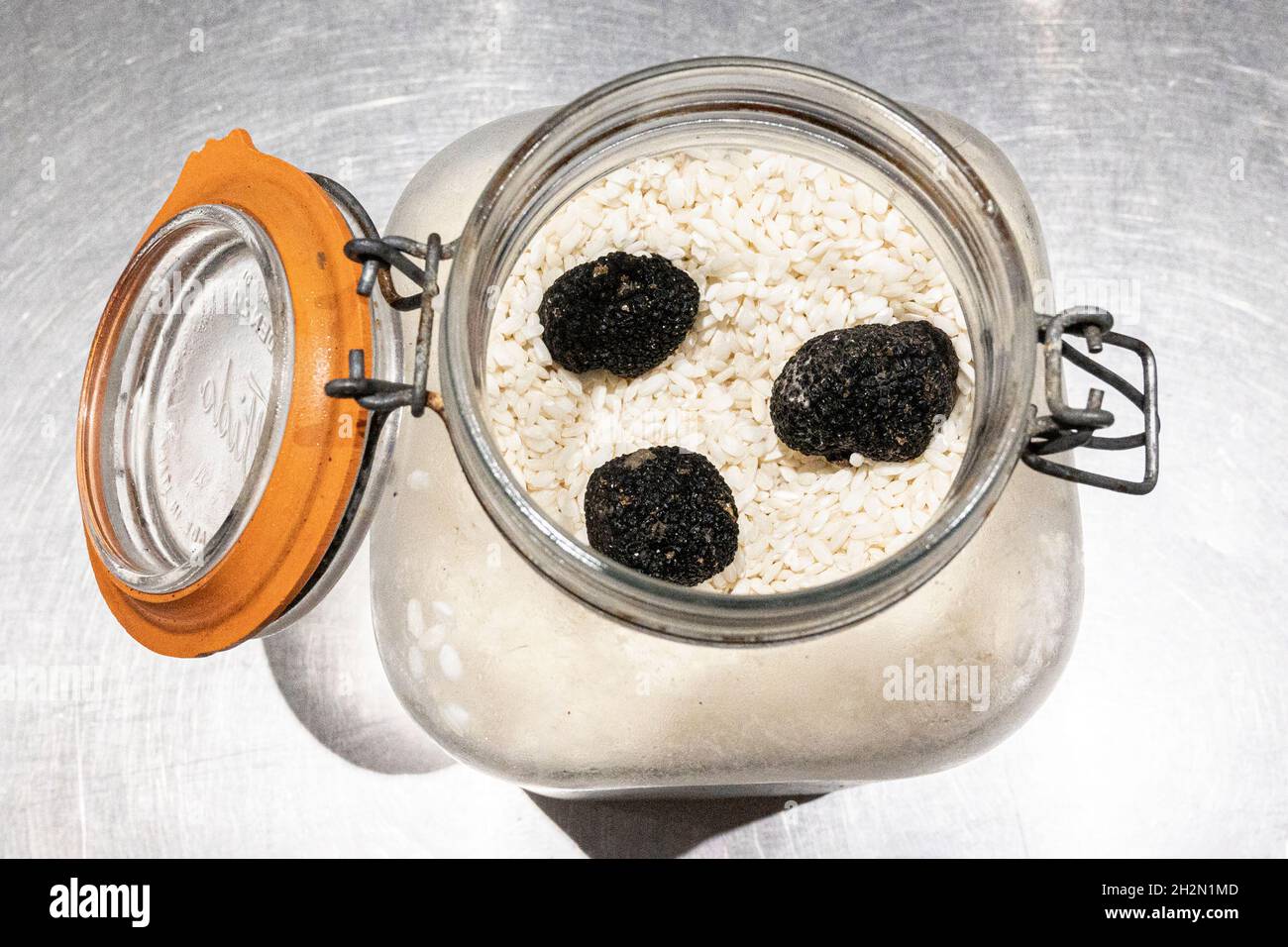 The best way to store truffles: to keep them dry on a bed of rice in a closed glass jar. Stock Photo