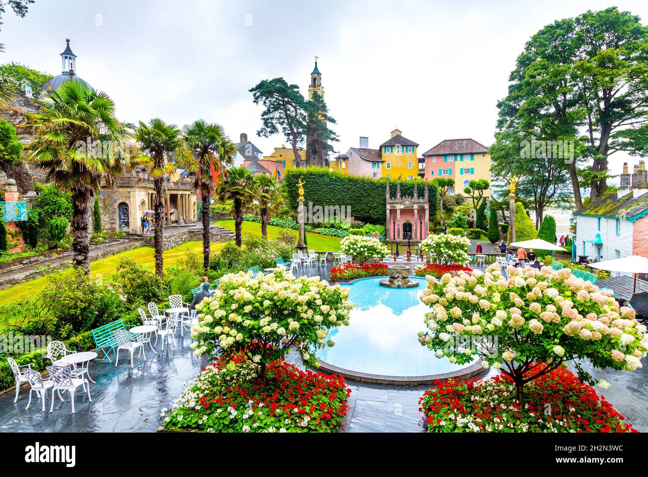 Colourful buildings and fountain at Mediterranean style town Portmeirion, Snowdonia National Park, Wales, UK Stock Photo