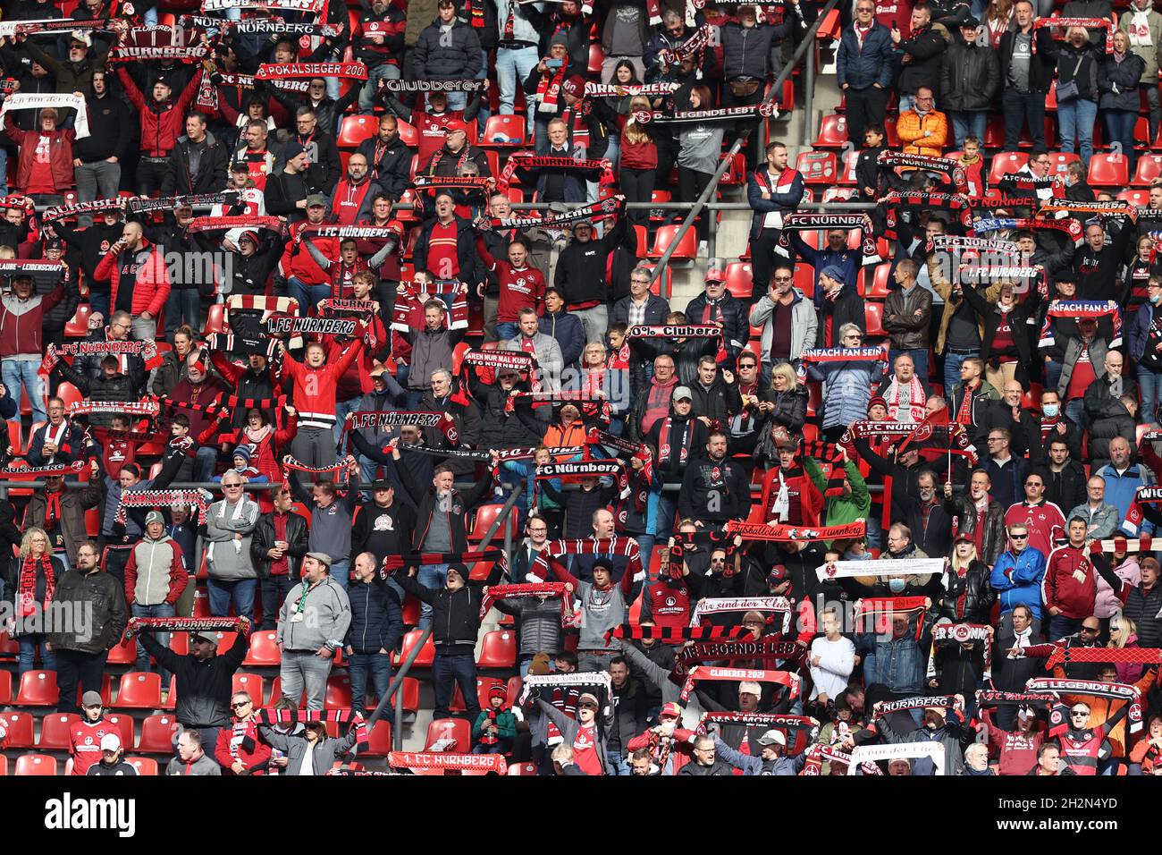 Nuremberg, Germany. 23rd Oct, 2021. Football: 2. Bundesliga, 1. FC Nürnberg  - 1. FC Heidenheim, Matchday 11 at Max-Morlock-Stadion. Nuremberg fans sing  the club anthem. Credit: Daniel Karmann/dpa - IMPORTANT NOTE: In