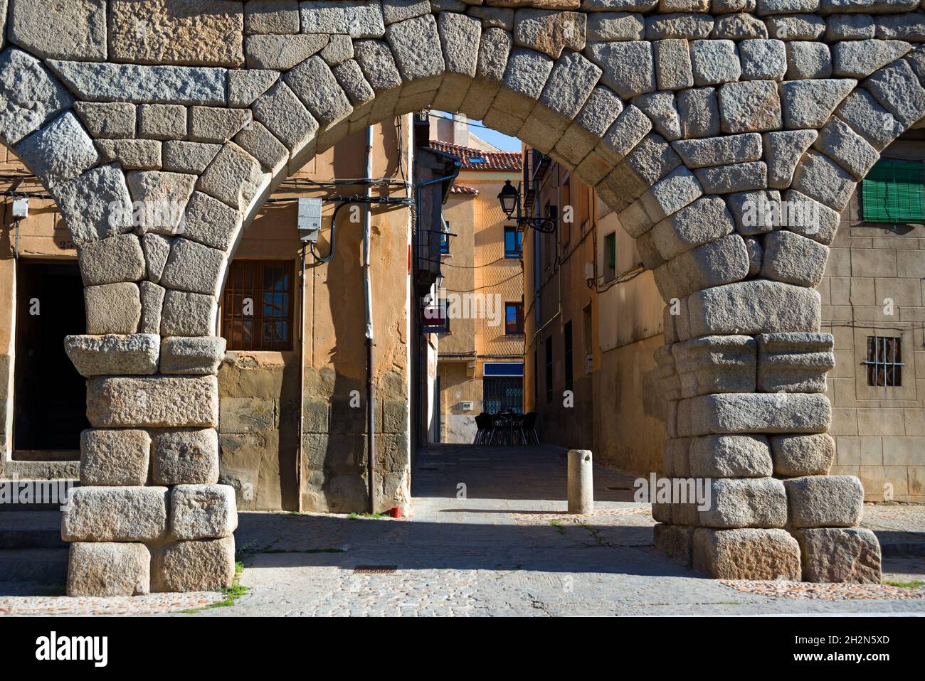 Arch of Roman aqueduct in old city Stock Photo