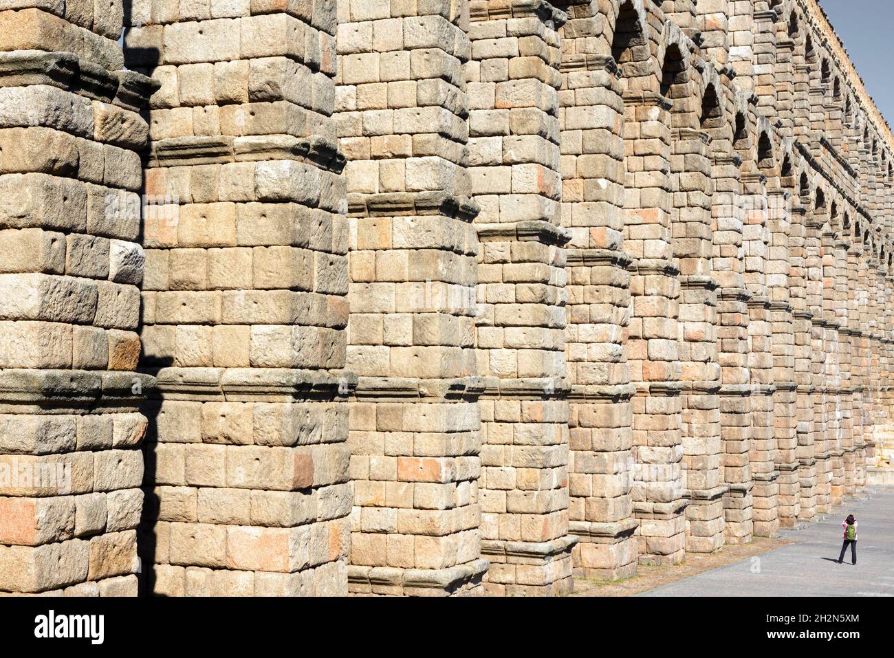 Side view of Roman aqueduct in Segovia, Spain Stock Photo