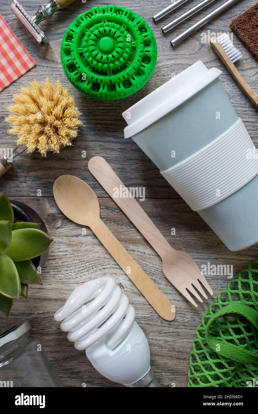 Flat Lay Shot Of Plastic Free Eco Products With Reusable Or Sustainable Zero Waste Products On Wooden Background With Metal Staws Wooden Cutlery Paper Stock Photo
