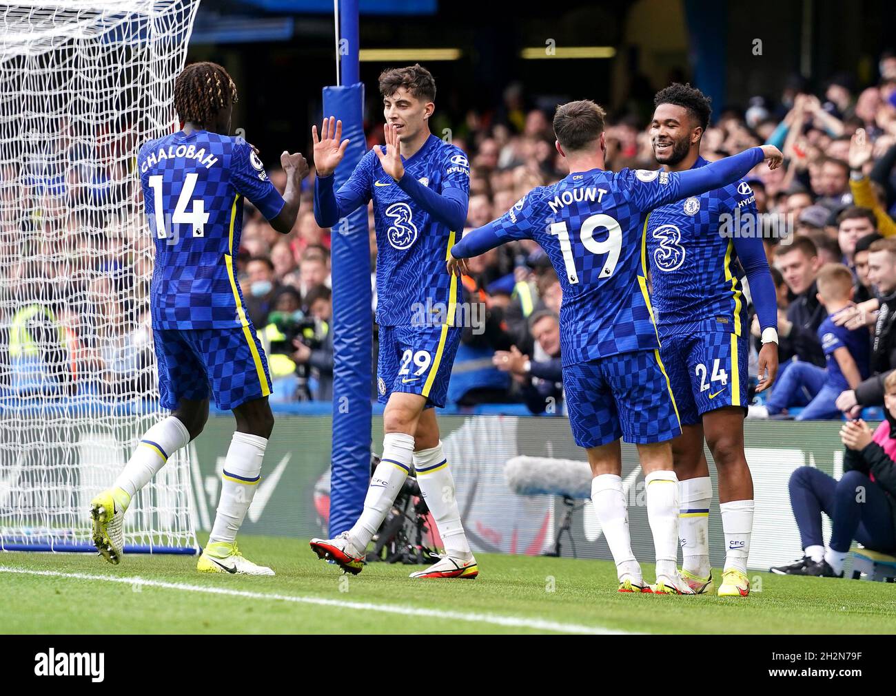 Chelsea's Reece James (right) celebrates scoring their side's third goal of the game with team-mates Trevoh Chalobah, Kai Havertz and Mason Mount, during the Premier League match at Stamford Bridge, London. Picture date: Saturday October 23, 2021. Stock Photo