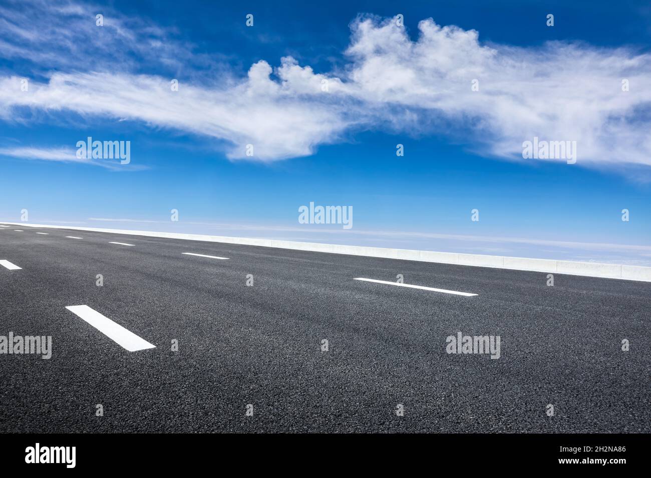 Empty asphalt road and blue sky with white clouds scenery Stock Photo ...
