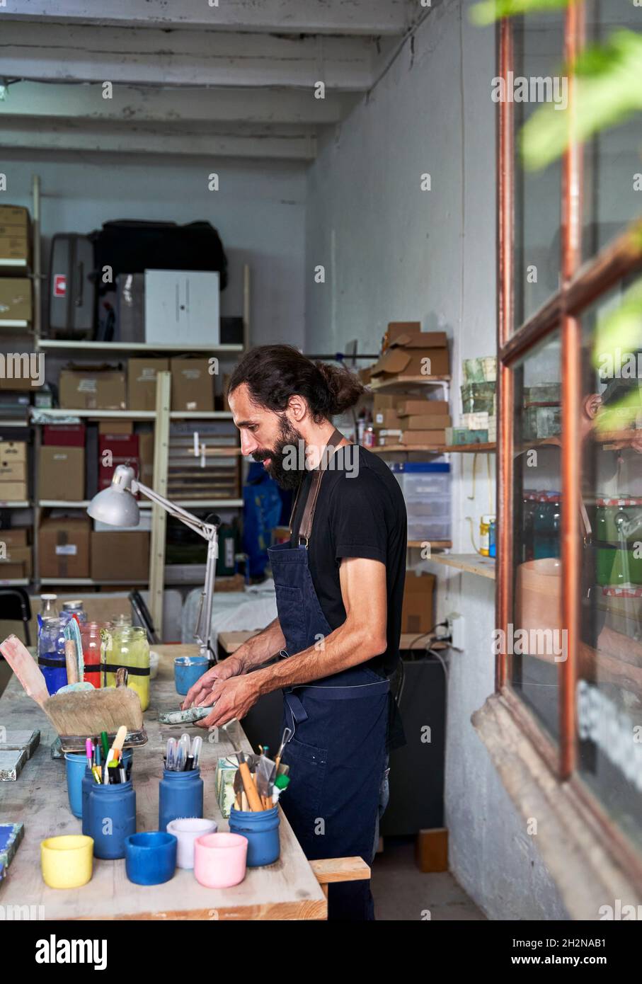 Male design professional working in workshop Stock Photo