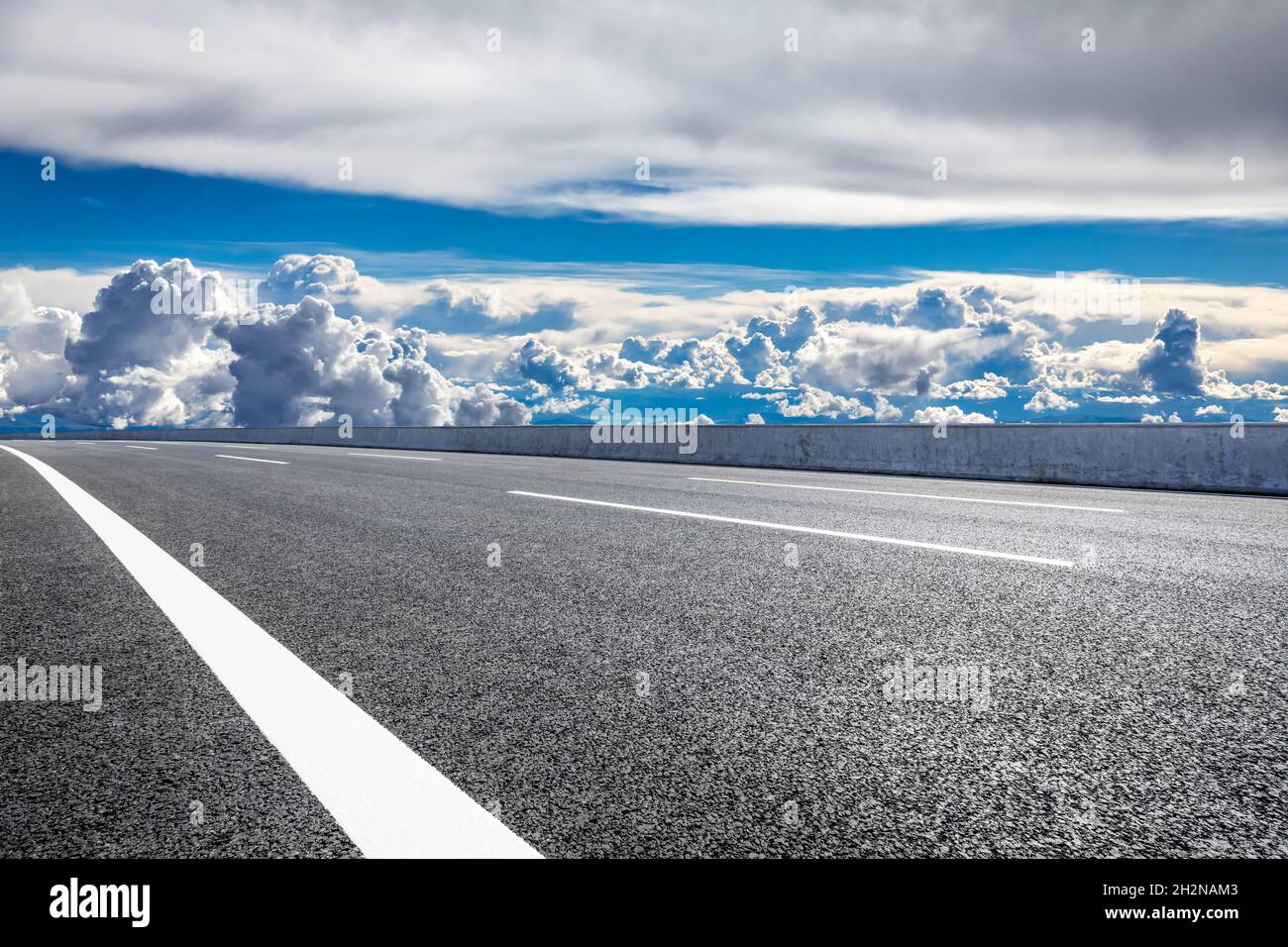 Empty asphalt road and blue sky with white clouds scenery Stock Photo ...