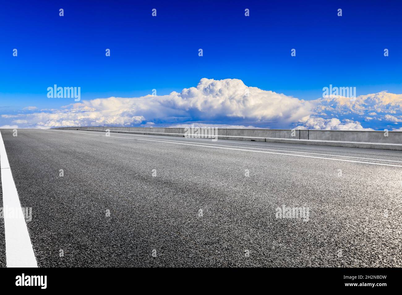 Empty asphalt road and blue sky with white clouds scenery Stock Photo ...