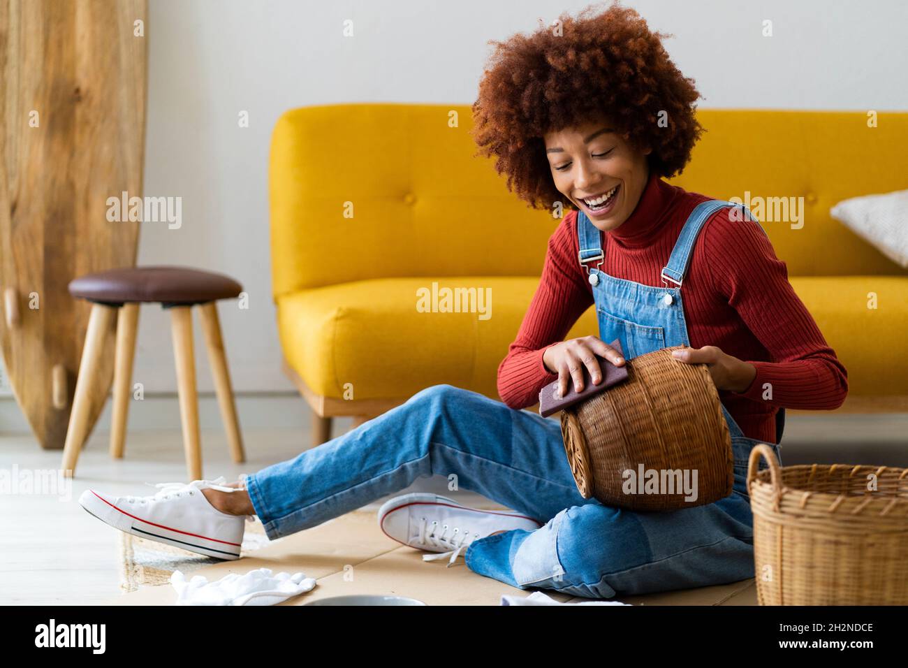 How to Clean Wicker Indoor Furniture | 9 Easy Steps (2026) - Polishing Wicker Basket Furniture In Living Room With Wax