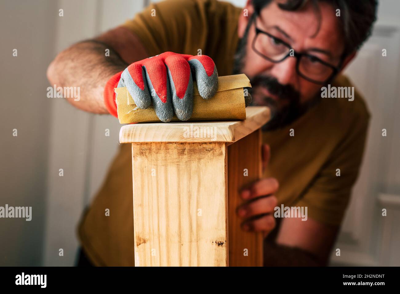 Male carpenter working at home Stock Photo