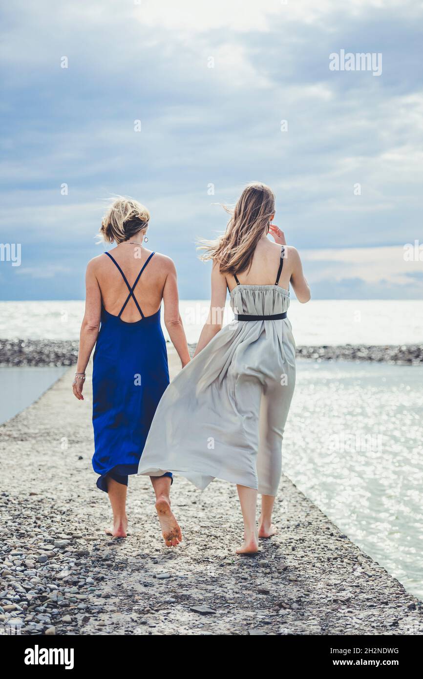 Woman walking together hi-res stock photography and images - Alamy