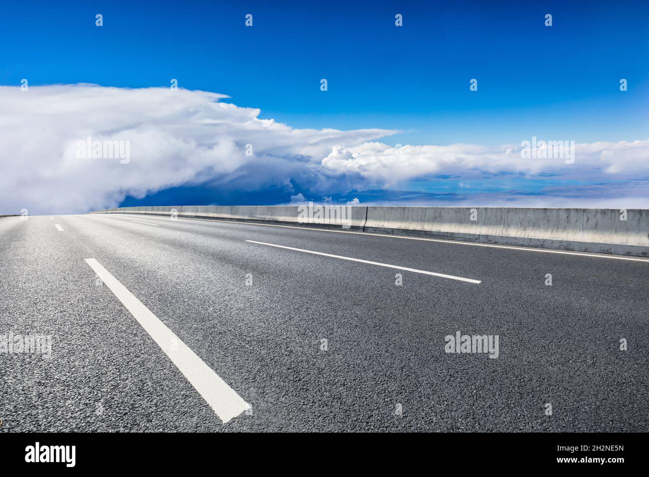 Empty asphalt road and blue sky with white clouds scenery Stock Photo ...