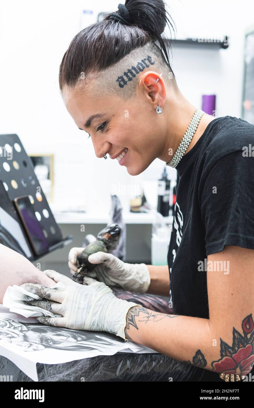 Man with tattoo on arm in studio Stock Photo - Alamy