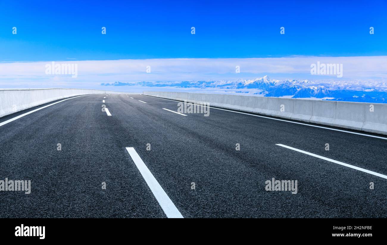 Asphalt road and mountain with sky clouds landscape Stock Photo - Alamy