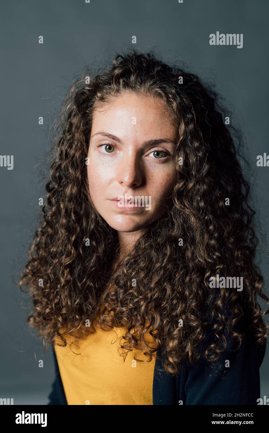 Curly hair woman studio hi-res stock photography and images - Alamy