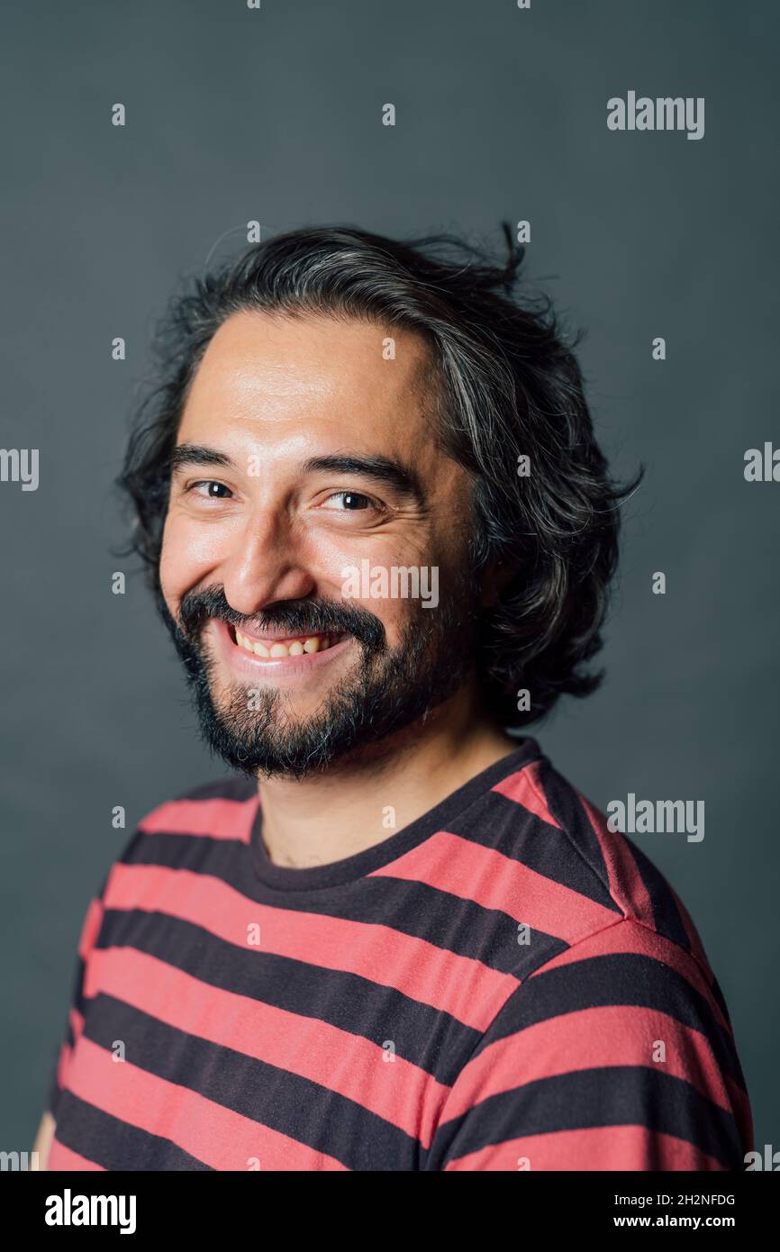 Smiling mid adult man in studio Stock Photo
