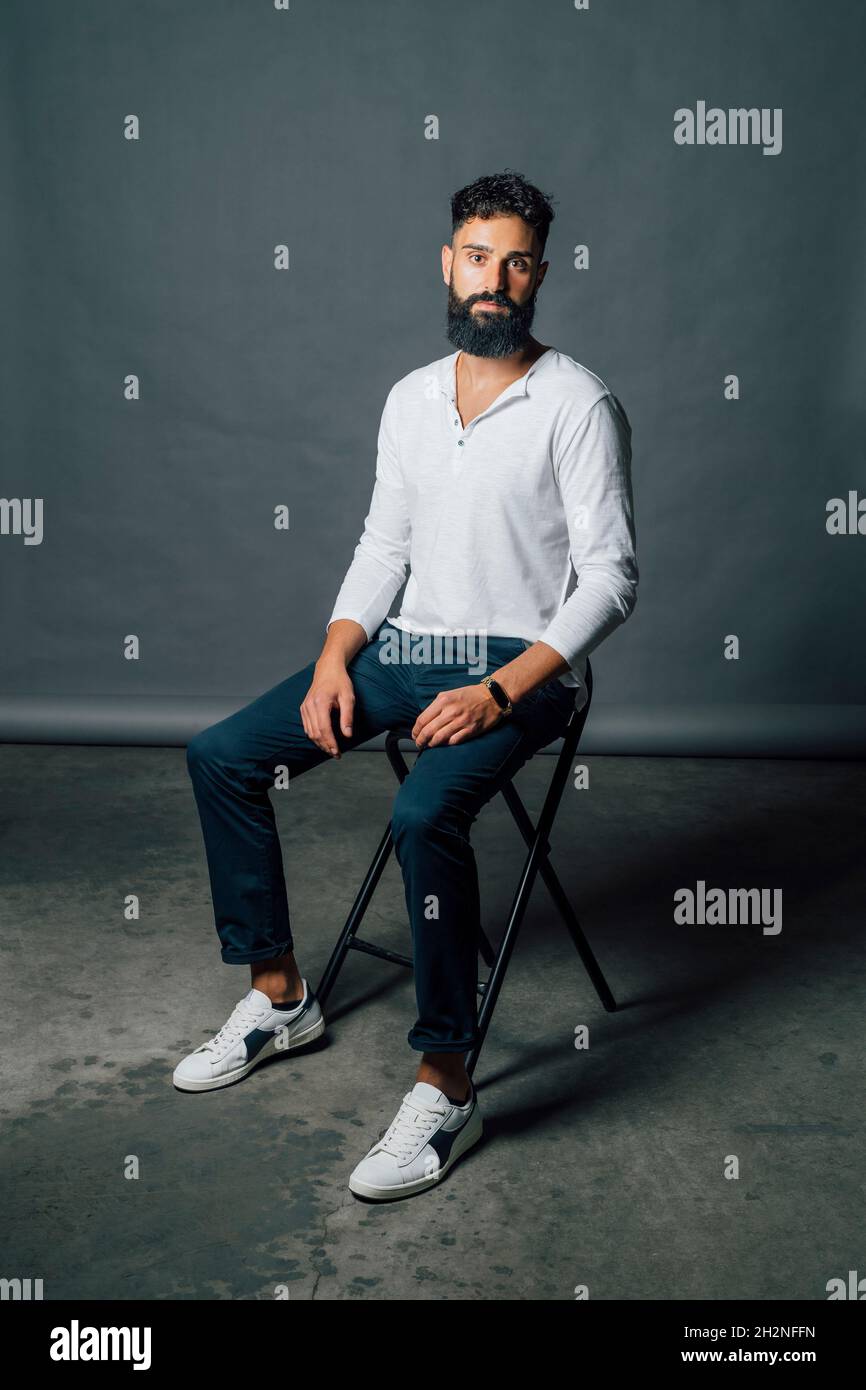 Man sitting chair studio shot hi-res stock photography and images - Alamy