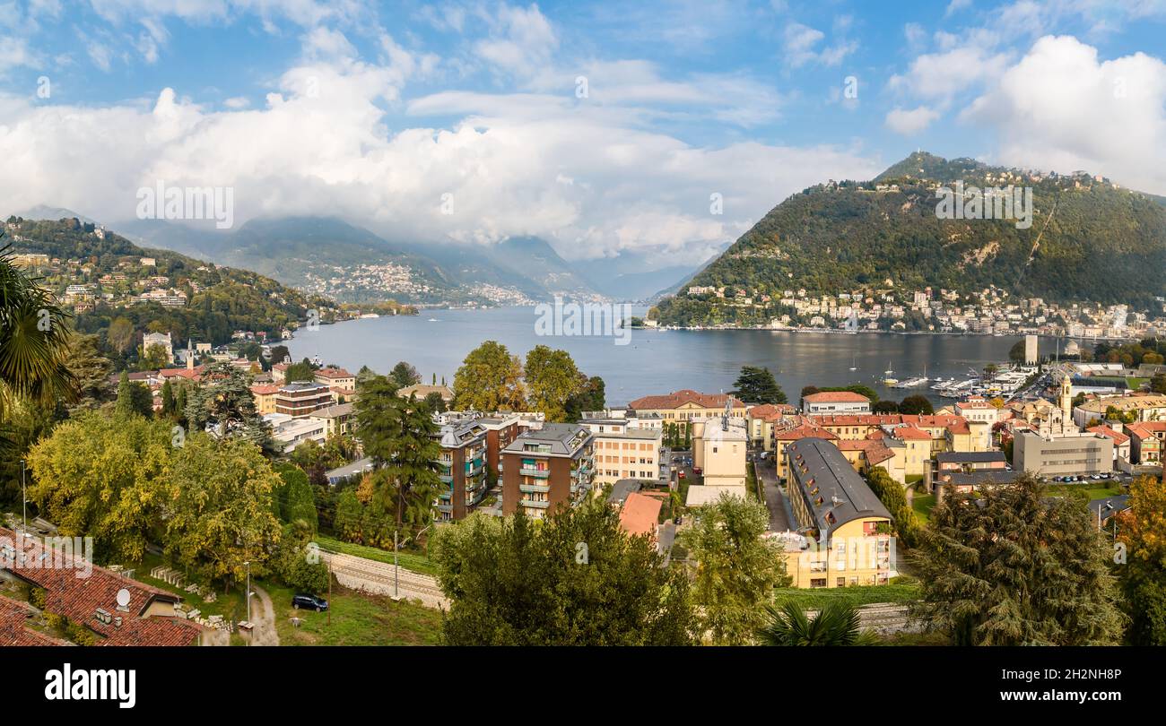 Panoramic view of Lake Como and Como town in a sunny autumn day, Italy Stock Photo