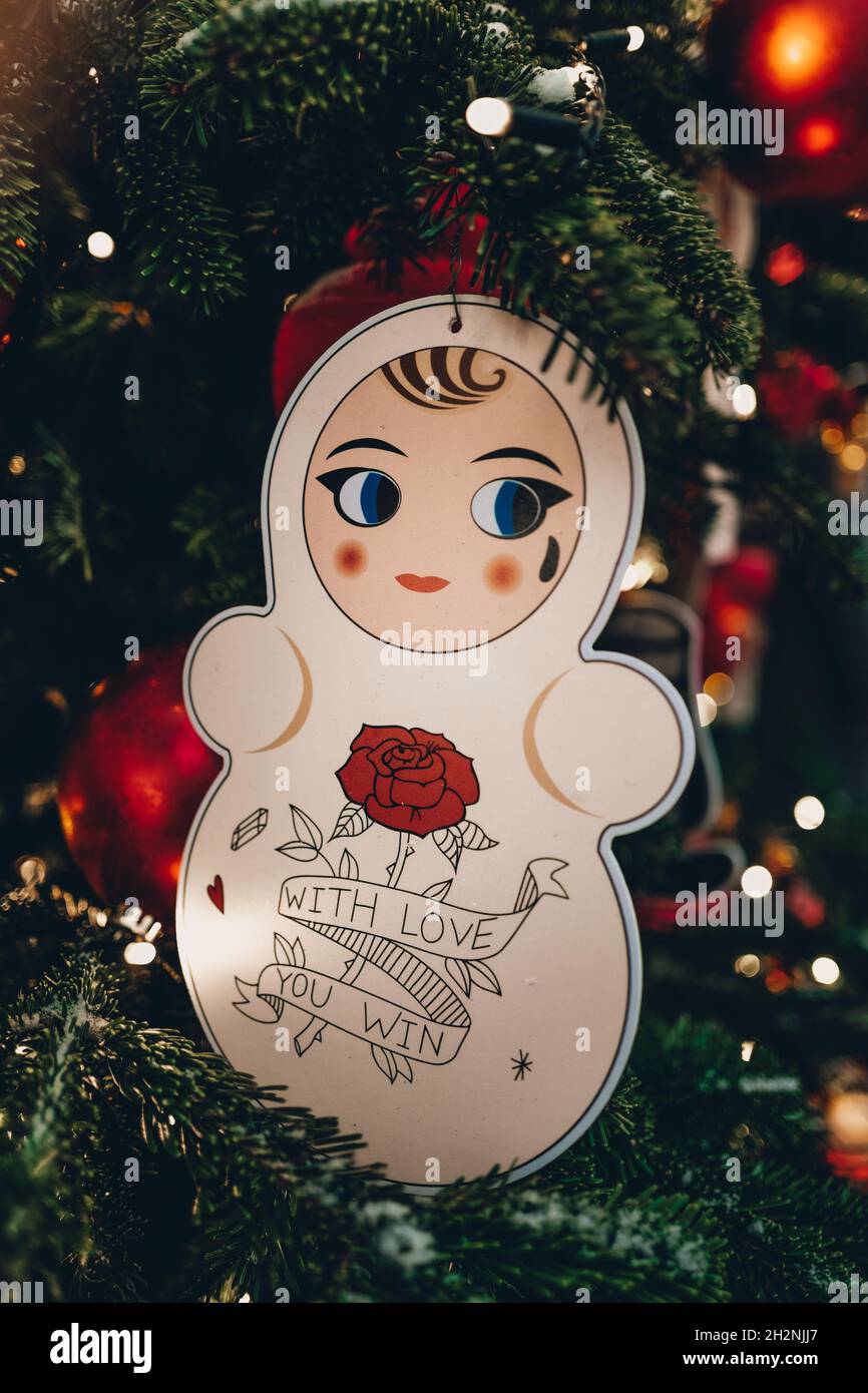 Win A Christmas Tree 2022 Creative Christmas Toy Hanging On The Christmas Tree With Blurry Golden  Festive Lights On Background. Merry Christmas And Happy New Year 2022 Magic  De Stock Photo - Alamy