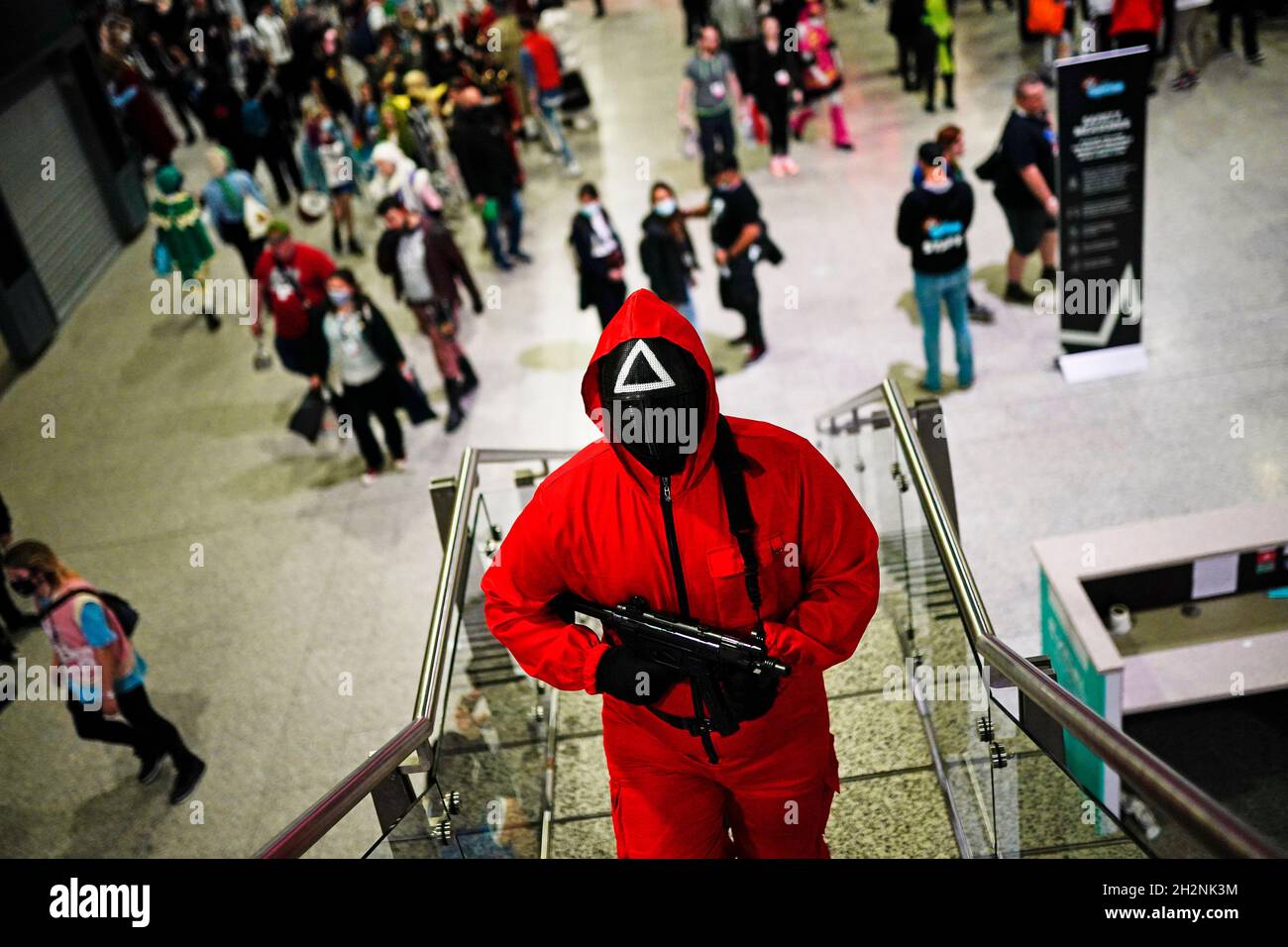 Joshua Bizzell from Greater London dressed as a character from the Netflix series Squid Game during the second day of MCM Comic Con at the ExCel London in east London. Picture date: Saturday October 23, 2021. Stock Photo