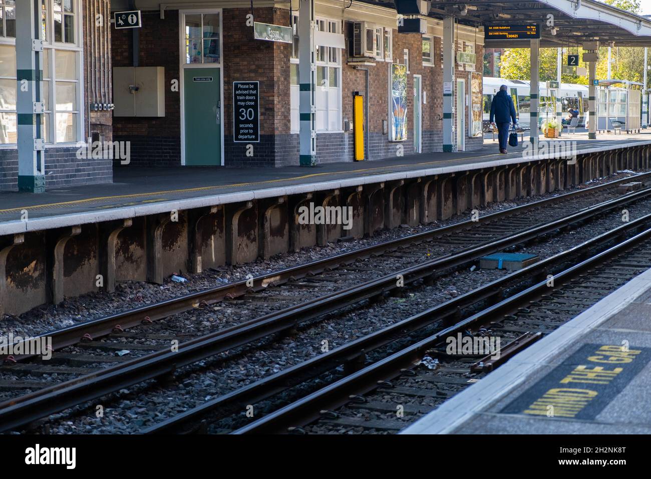 Rail Track Running Through Epsom Station In Surrey With A Person