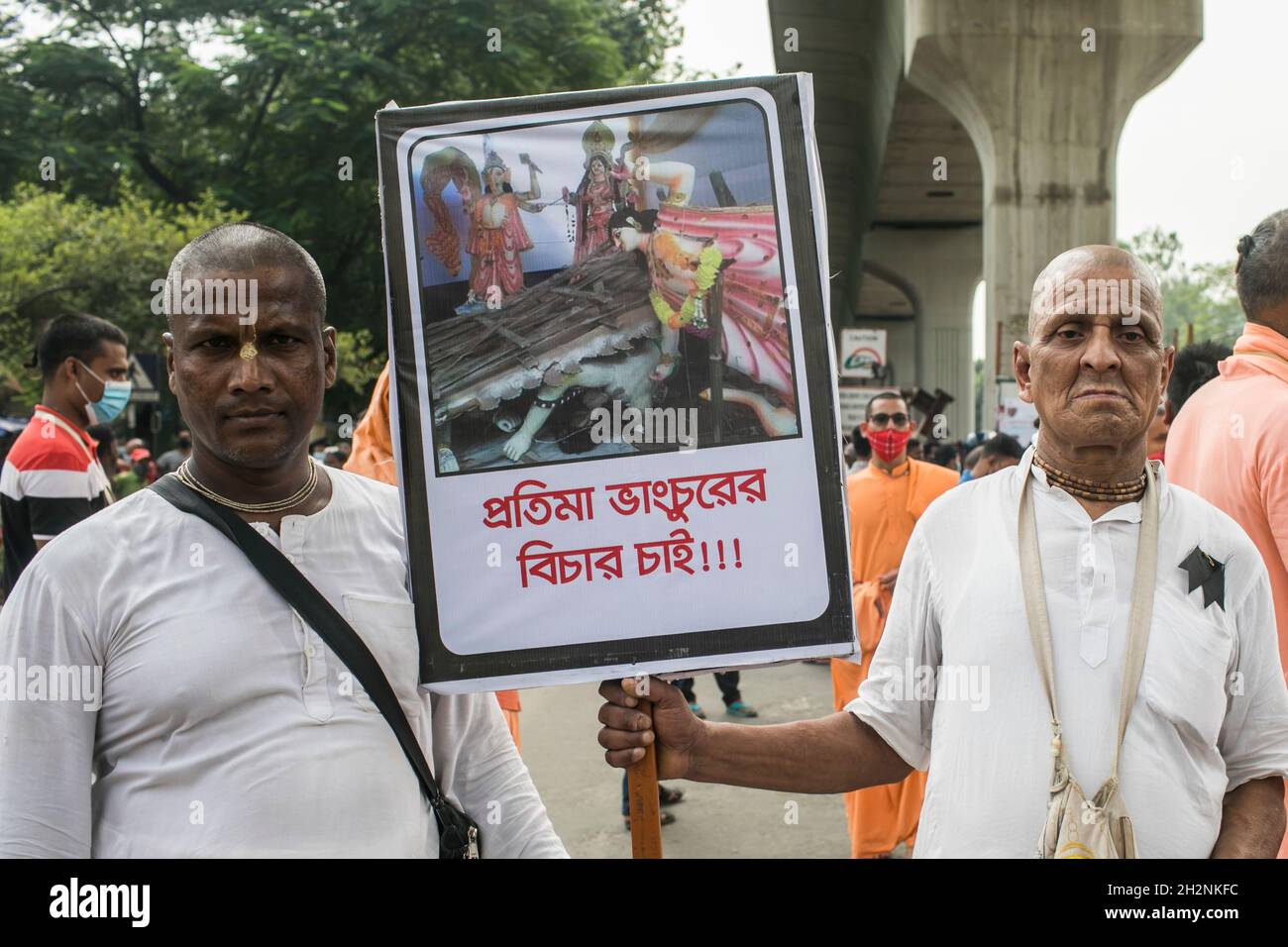 A protester holds a placard during the demonstration.Hindu Buddhist Christian Unity council and International Society for Krishna Consciousness (ISKCON)  staged a demonstration in Dhaka against the recent religious violence against the Hindu community in Bangladesh. (Photo by Sazzad Hossain / SOPA Images/Sipa USA) Stock Photo