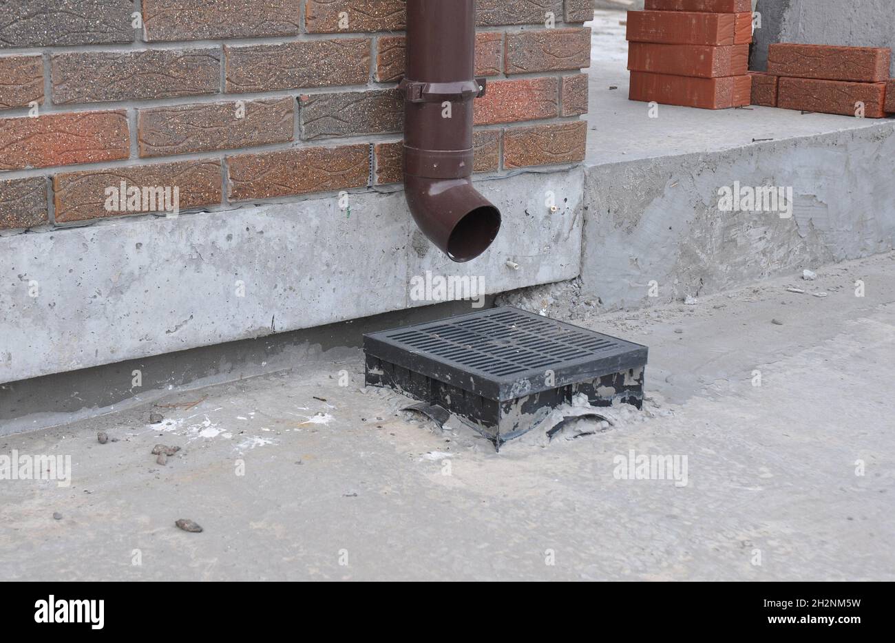 Rain gutter downspout drainage installation. Gutter Downspout for