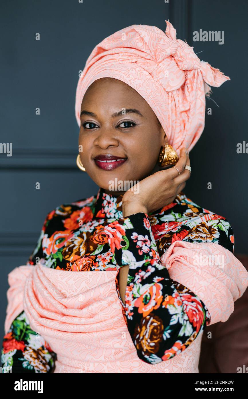 Romantic Cute African Woman Wearing Stylish Traditional Dress With African Print And Headwrap Posing On Studio Dark Background Stock Photo Alamy