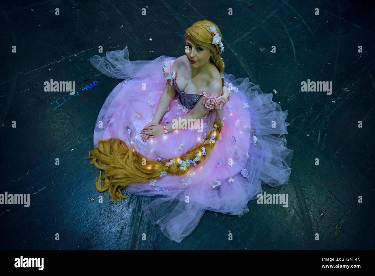 A cosplayer dressed as Rapunzel during the second day of MCM Comic Con at  the ExCel London in east London. Picture date: Saturday October 23, 2021  Stock Photo - Alamy, image size:1300x956