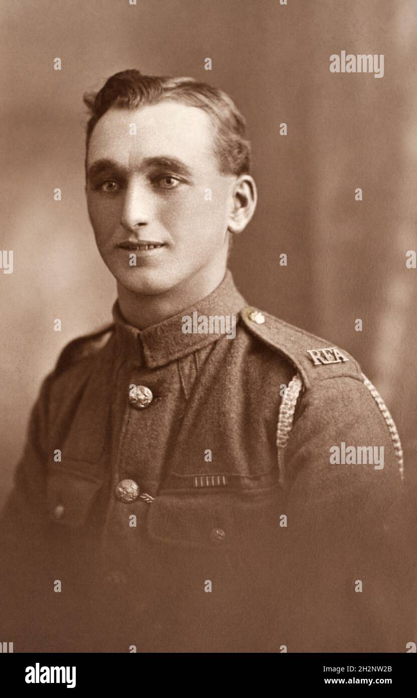 A portrait a First World War British soldier, a Gunner in the Royal Field Artillary  (RFA), with shoulder title and General Service Corps buttons. This soldier has a medal ribbon for the Croix de Guerre, a French bravery decoration that was also often awarded to British troops. Stock Photo
