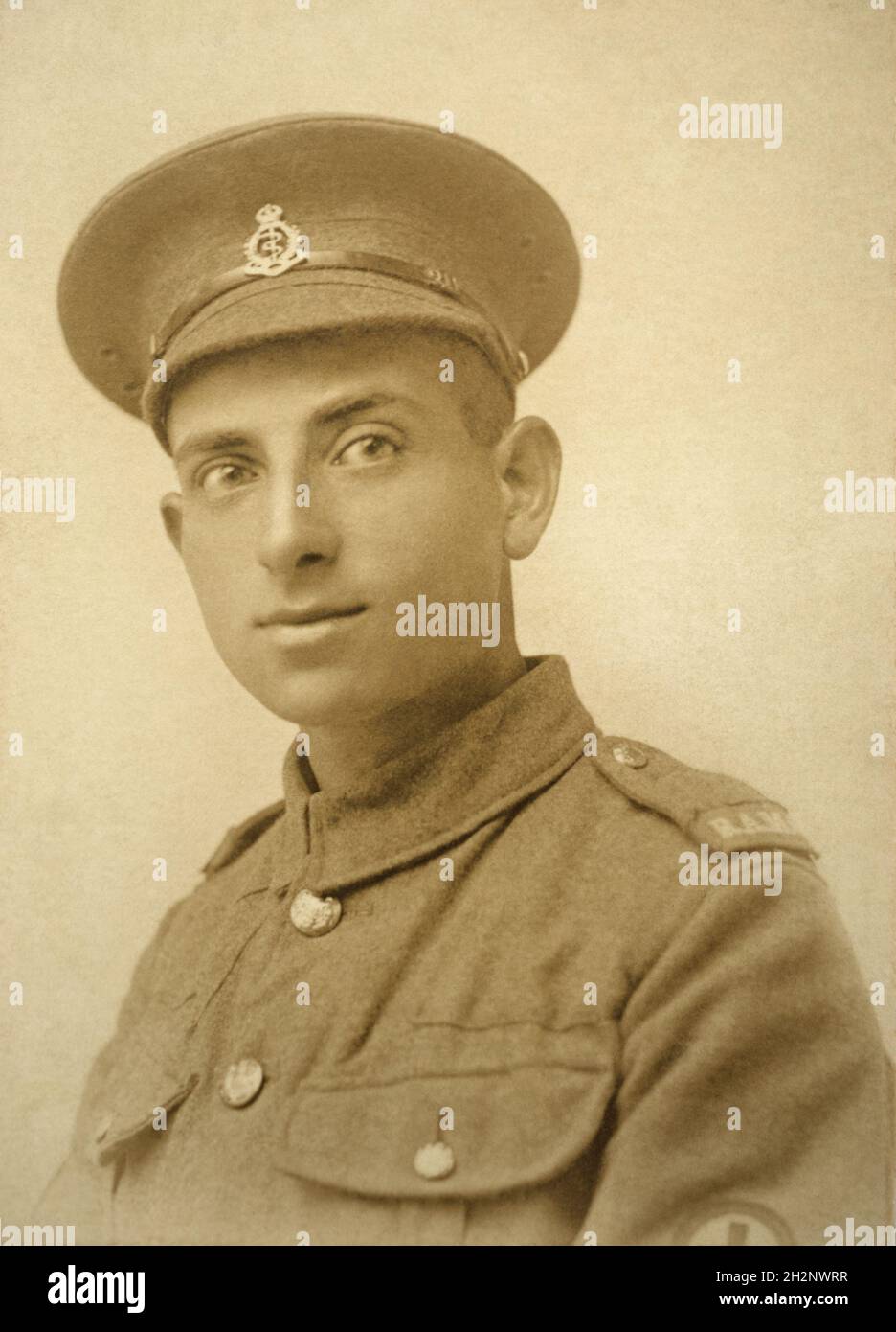 A First World War era portrait of a British army soldier, a Private in the Royal Army Medical Corps (RAMC). He has cloth RAMC shoulder titles rather than the usual metal versions. Stock Photo