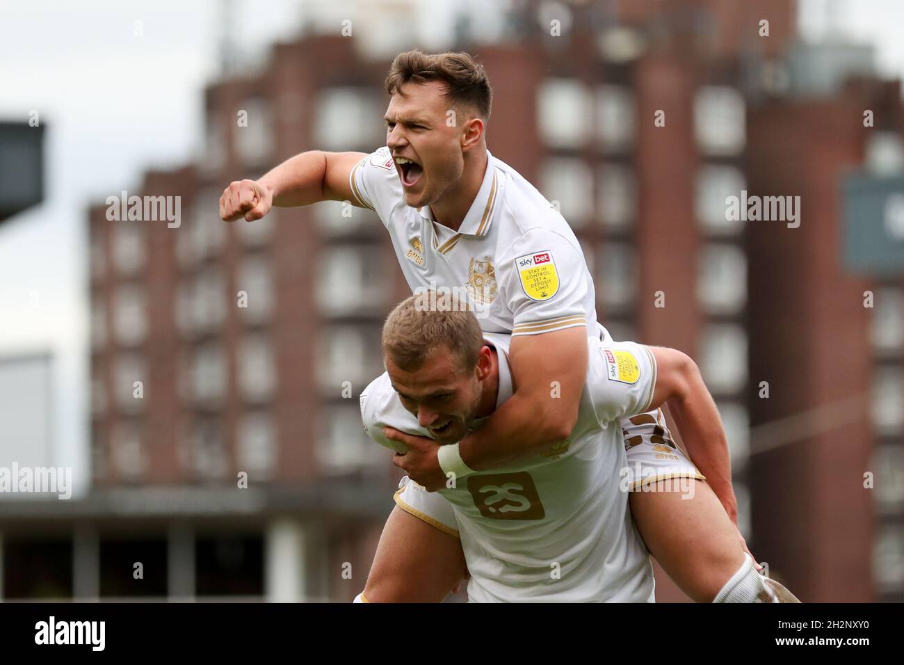 Port Vale's James Wilson celebrates with Dennis Politic after scoring his side's second goal of the Sky Bet League Two match at Vale Park, Stoke. Picture date: Saturday October 2, 2021. Stock Photo