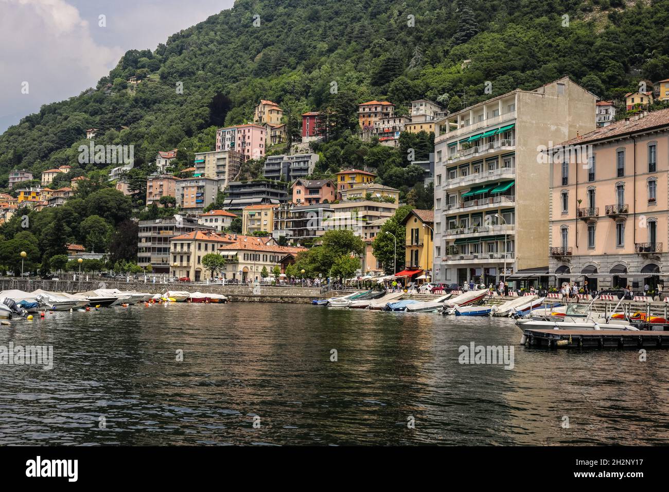 Como, Italy - June 15, 2017: View of Traditional Colorful Buildings in Lake Como on a Cloudy Day Stock Photo