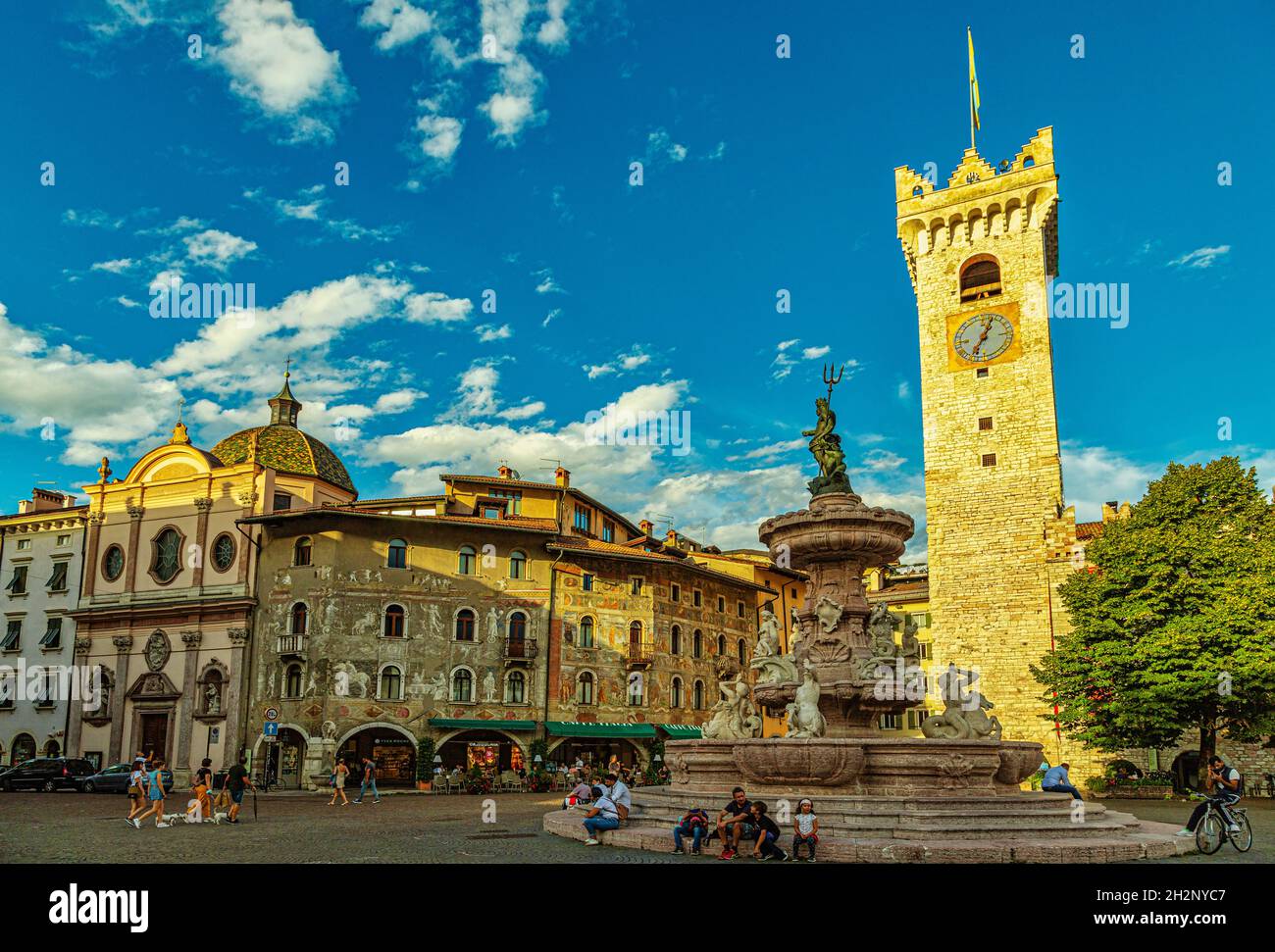 Piazza Duomo in Trento, with frescoed houses, a civic tower with a clock and a monumental fountain. Province of Trento, Trentino-Alto Adige, Italy Stock Photo