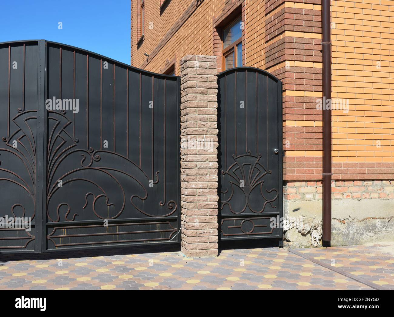 Outdoor house gate and metal door installation Stock Photo Alamy