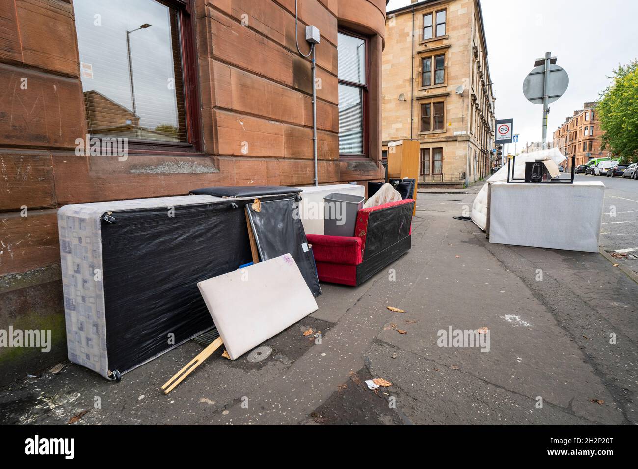 Glasgow, Scotland, UK. 23rd October 2021. Domestic waste is seen discarded in the streets of Govanhill in Glasgow with one week to the start of the UN Climate Change Conference COP26 in the city. City refuse collectors have said they will strike during the conference leading to fears that the city streets will be full of rubbish while in the world’s spotlight.  Iain Masterton/Alamy Live News. Stock Photo