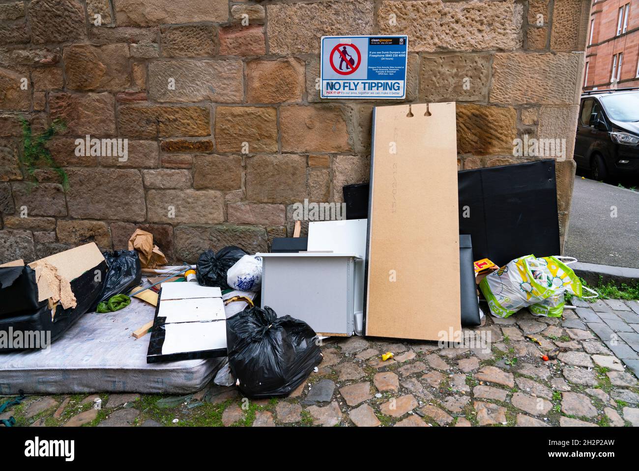 Glasgow, Scotland, UK. 23rd October 2021. Domestic waste is seen discarded in the streets of Govanhill in Glasgow with one week to the start of the UN Climate Change Conference COP26 in the city. City refuse collectors have said they will strike during the conference leading to fears that the city streets will be full of rubbish while in the world’s spotlight.  Iain Masterton/Alamy Live News. Stock Photo