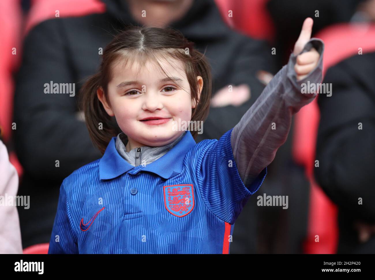 London, England, 23rd October 2021. A young England fan gives a thumbs up before the FIFA 2023 Women's World Cup Qualifying match at Wembley Stadium, London. Picture credit should read: Paul Terry / Sportimage Stock Photo