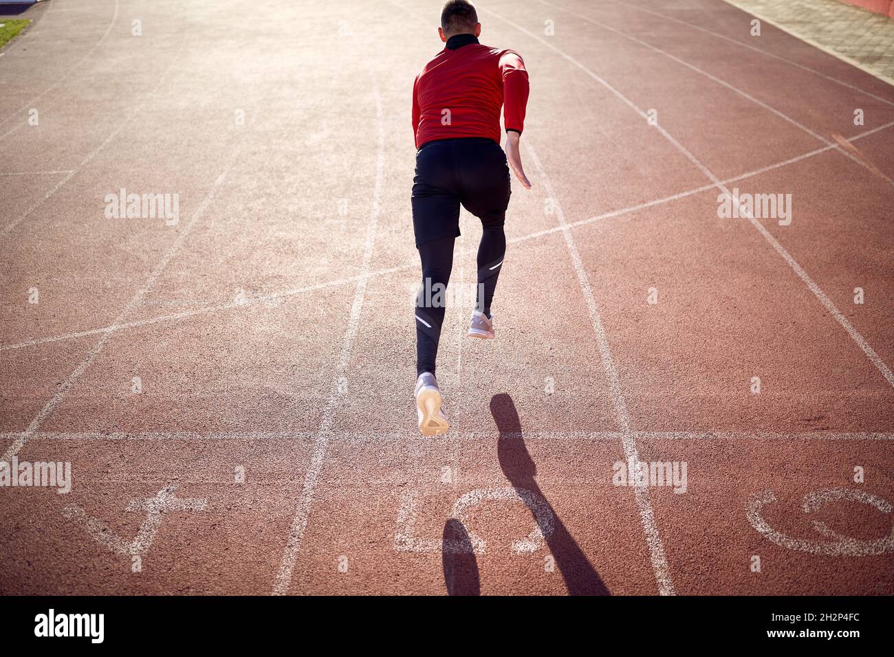 Professional male athlete having a training on the stadium Stock Photo