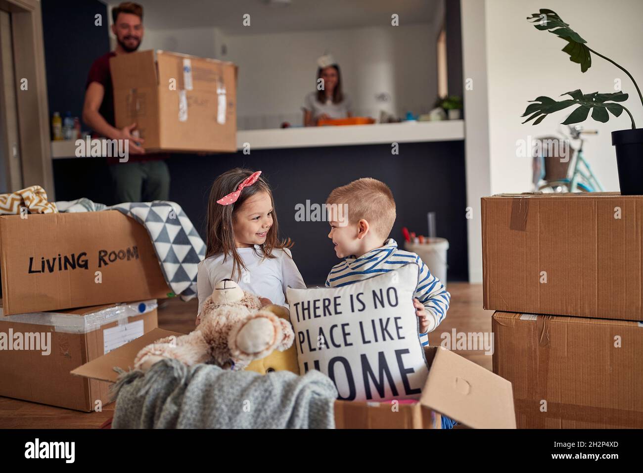 Happy children playing in new house on the floor Stock Photo - Alamy