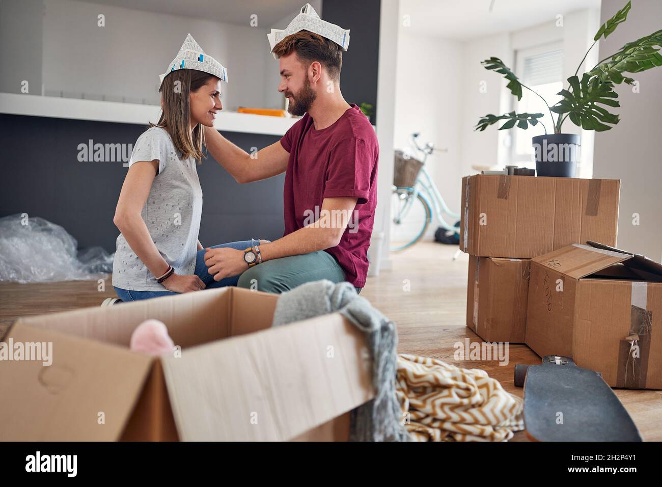 young married couple in love is about to kiss in their brand new apartment. just moved in. Stock Photo