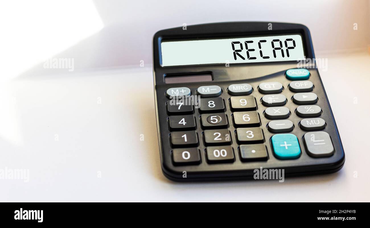 Business and finance concept. On the calculator the inscription - RECAP, on a white background Stock Photo