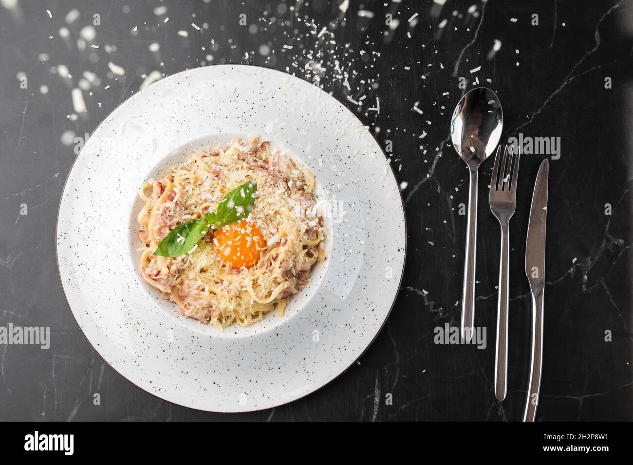 Pasta Carbonara. Spaghetti with bacon, parmesan, cream sauce and egg