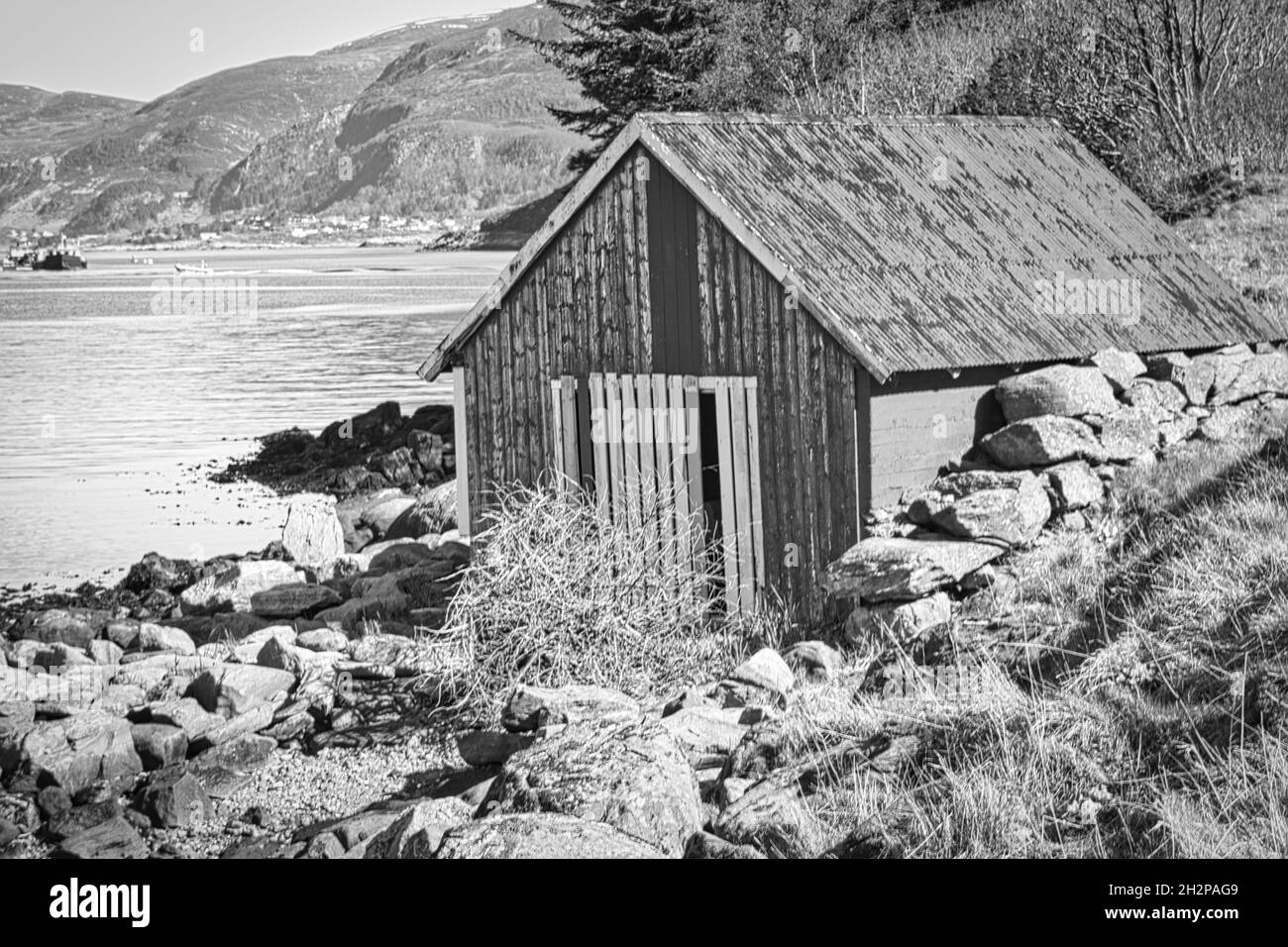 fishing lodge in norway on the fjord in black and white. historical view Stock Photo