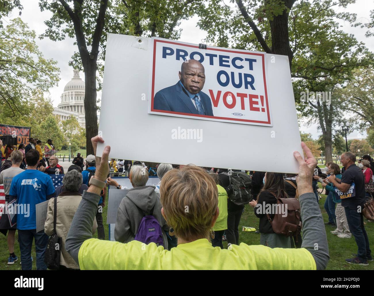 Protesting recent anti-voter legislation in states across the country, demonstrators at the Freedom to Vote rally near the U.S. Capitol to pressure congress to pass The Freedom to Vote Act, The John Lewis Voting Rights Advancement Act, and enact DC Statehood bills. Washington, DC, Oct. 23, 2021 Stock Photo