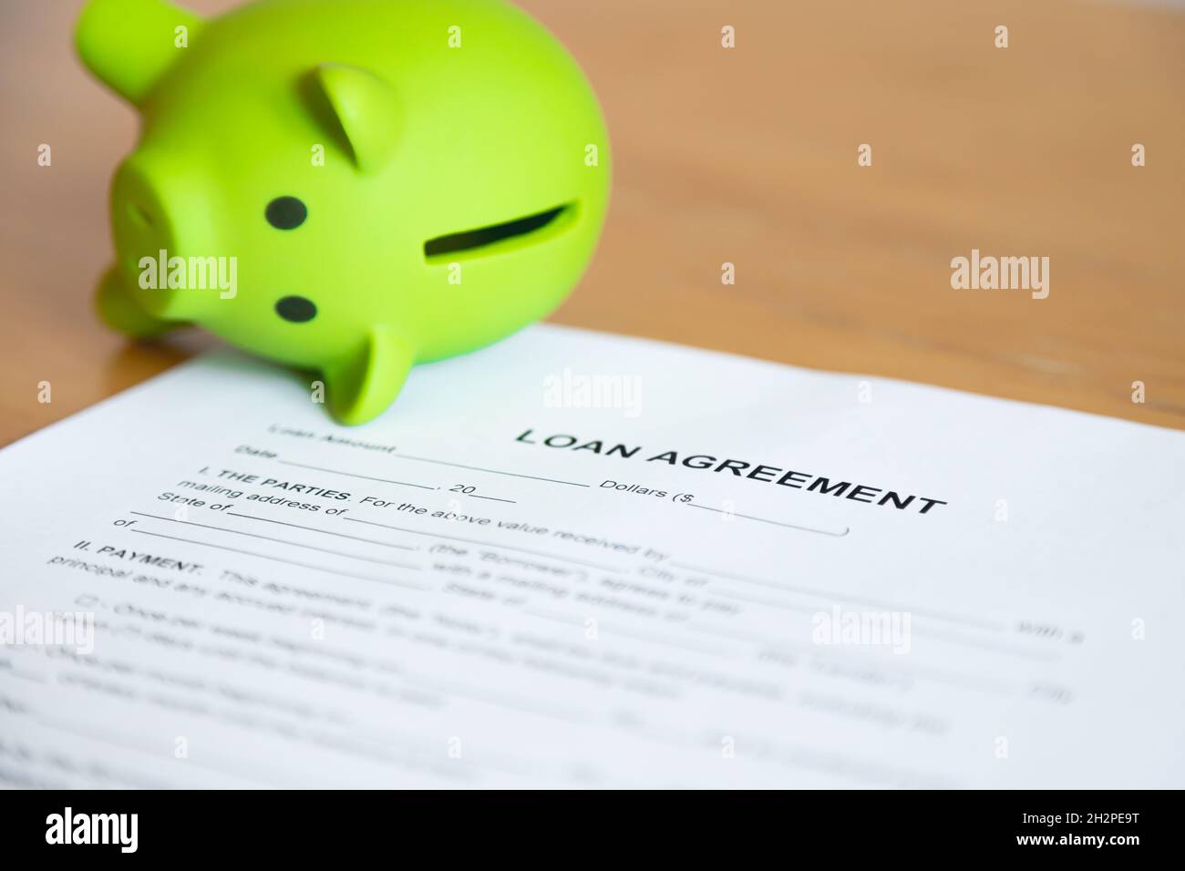 Loan agreement and empty piggy bank. A problem with repayment Stock Photo