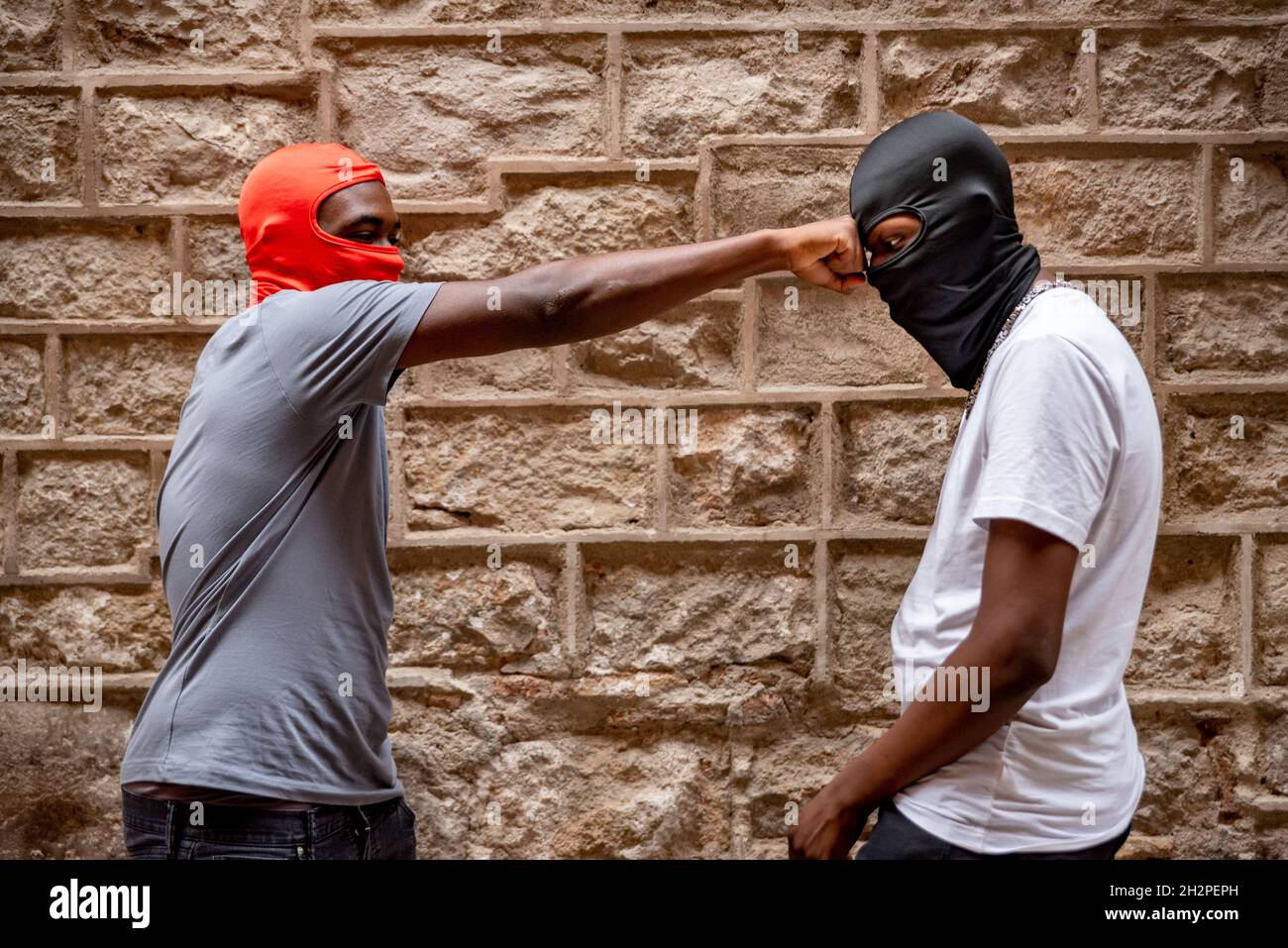 Two afro young men in ski masks in alleyway Stock Photo Alamy