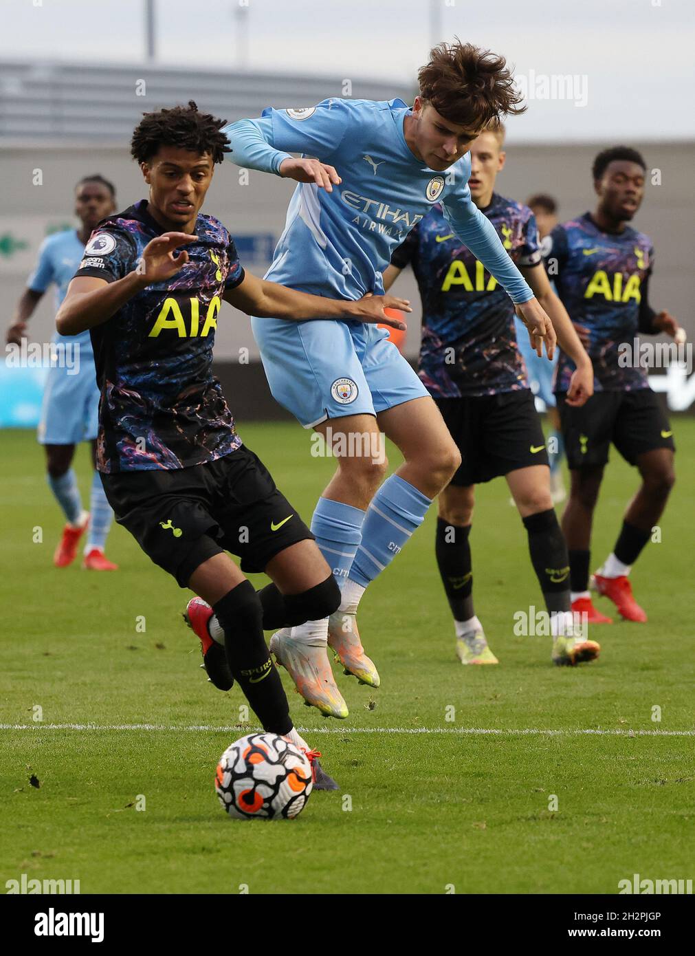 Manchester, England, 23rd October 2021.  Luca Barrington of Manchester City challenges Brooklyn Lyons-Foster of Tottenham during the Professional Development League match at the Academy Stadium, Manchester. Picture credit should read: Darren Staples / Sportimage Stock Photo